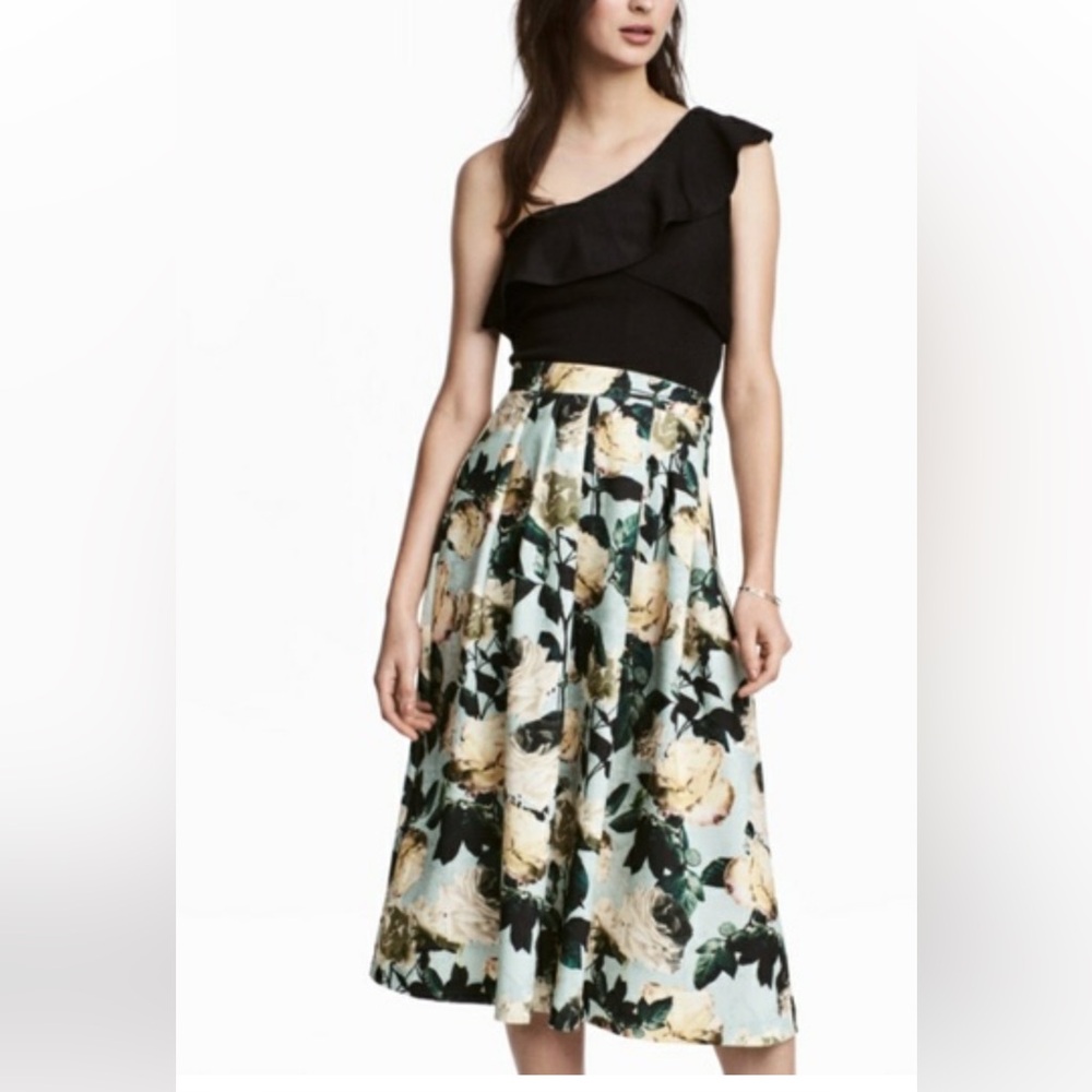 H&M midi length skirt pleated floral skirt pale blue background garden party